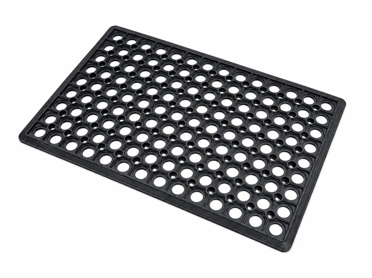 Black rubber mat with round drainage holes